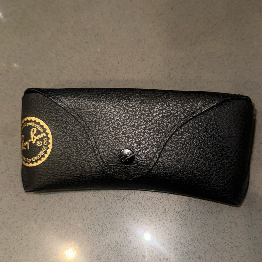 Black Ray-Ban sunglasses case with microfiber cleaning cloth.